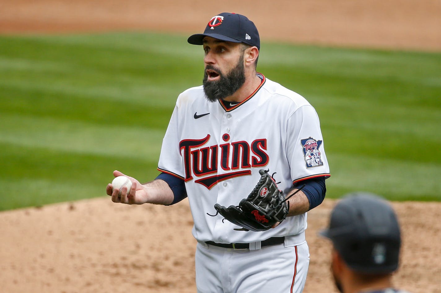 Minnesota Twins' Matt Shoemaker reacts to home plate umpire Adam Hamari after getting ejected from a baseball game with the Seattle Mariners in the sixth inning Sunday, April 11, 2021, in Minneapolis. (AP Photo/Bruce Kluckhohn)