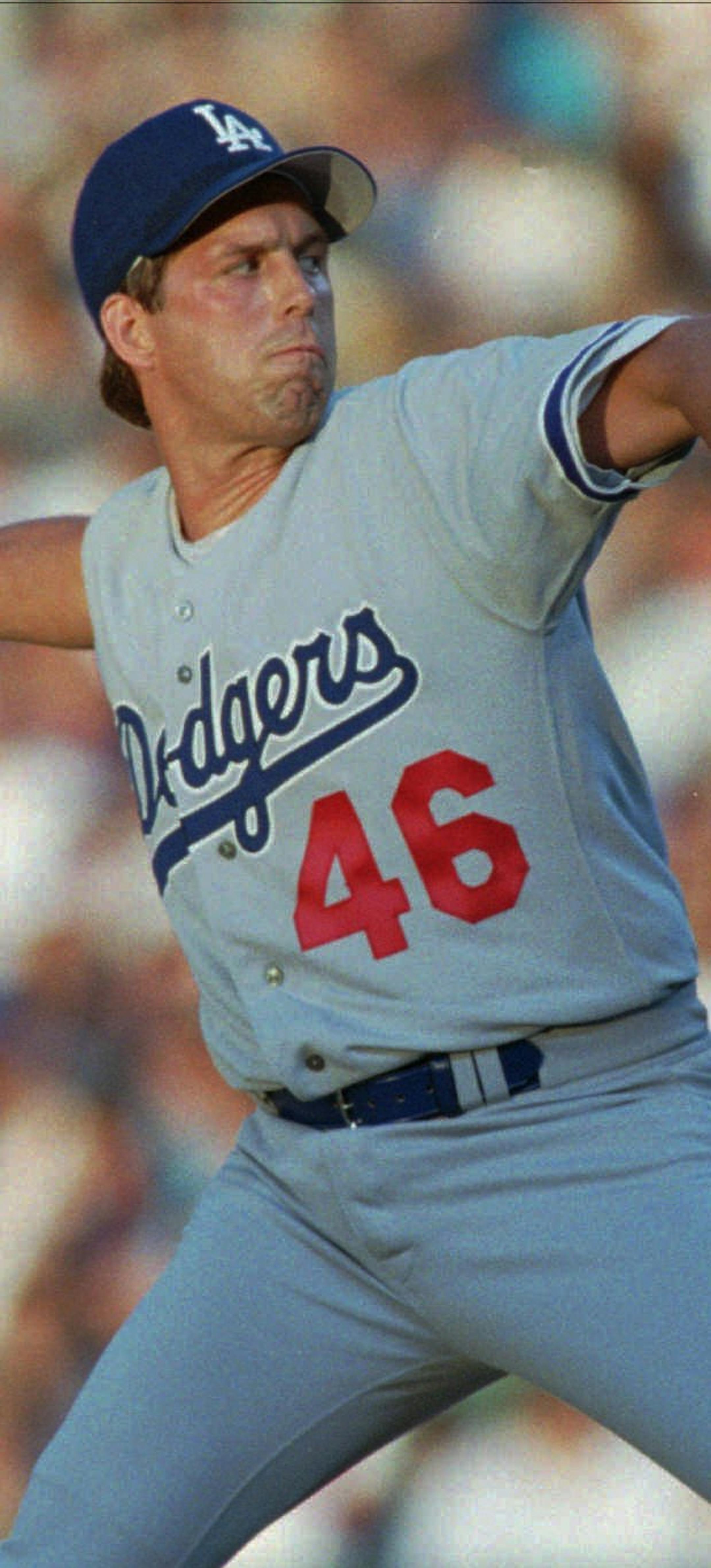 Los Angeles Dodgers starting pitcher Kevin Tapani delivers a pitch to Colorado Rockies batter Eric Young in the second inning in Denver's Coors Field on Wednesday, Aug. 2, 1995. Tapani made his Dodgers' debut against the Rockies after being acquired from the Minnesota Twins before the trade deadline. (AP Photo/David Zalubowski)