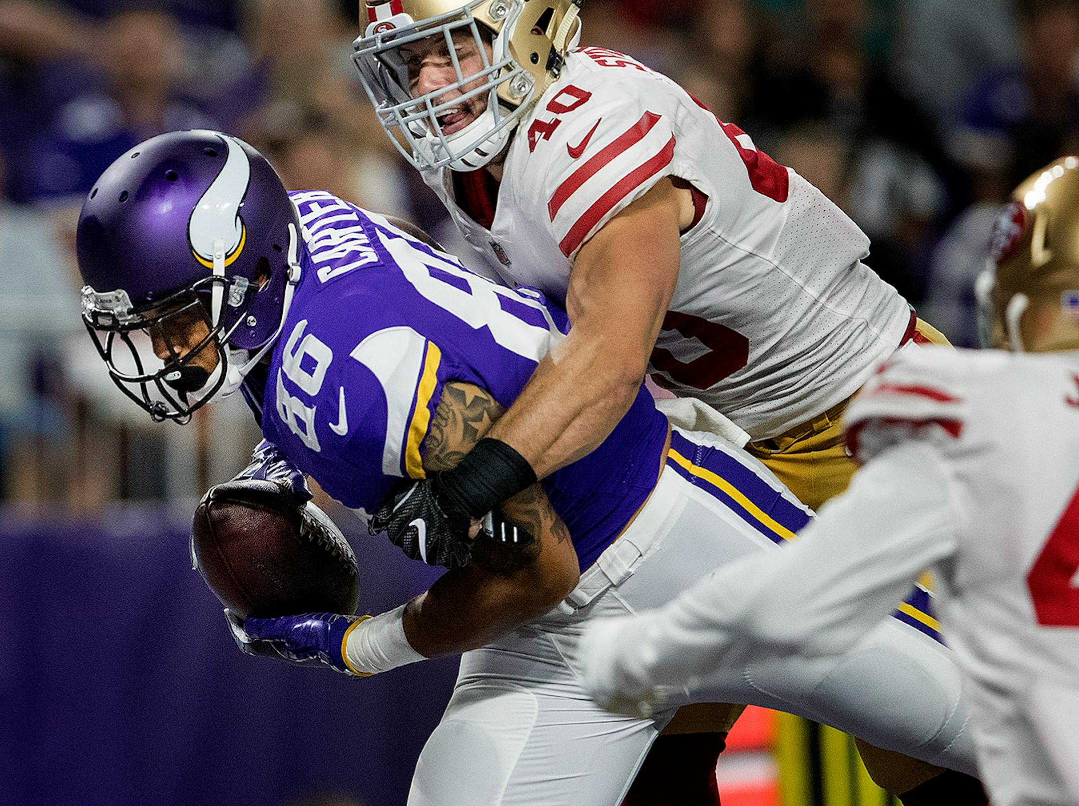 Vikings tight end Kyle Carter caught a touchdown pass in the fourth quarter.
