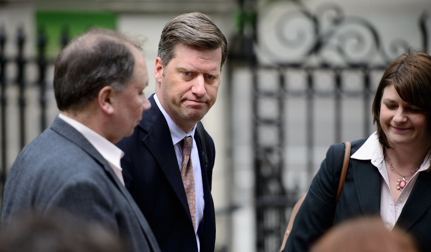 House Speaker Kurt Daudt entered the Governor's residence through the front main gate and spoke to the media. Behind him House Ways and Means Committee Chairman Jim Knoblach and Majority Leader Joyce Peppin.