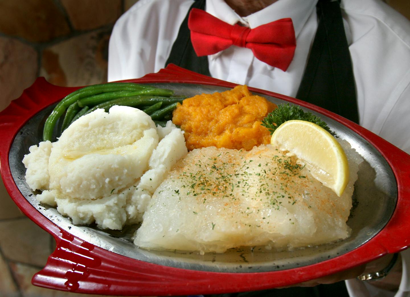 Tom Wallace &#xef; twallace@comcast.net Judy Lawton from Pearsons hold the holiday special Lutefisk plate that the restaurant serves through the holiday season. They will sell about 50 pounds in an avearge week. Pearson's Edina Restaurant, 3808 West 50th Street. 612 927 4464.