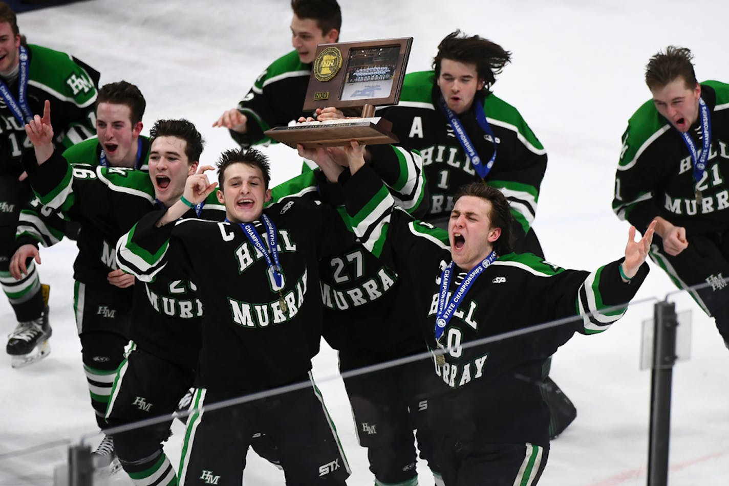 Hill-Murray players celebrated their 2A championship win over Eden Prairie.