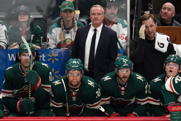 Wild interim coach Dean Evason watched from the bench in the second period.
