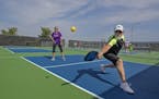 Bob Minter and Anna Hobbs paired up for a game pickle ball at the new pickle ball courts, Tuesday, July 11, 2017 at Forest Lake's Fenway Park in Fores