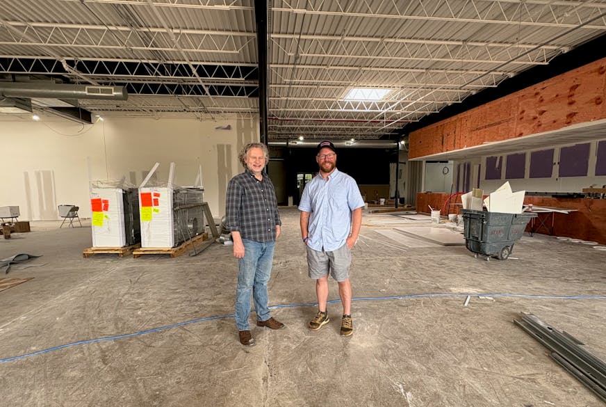 Rich Henriksen and Jon Wipfli inside the under construction Animales restaurant.