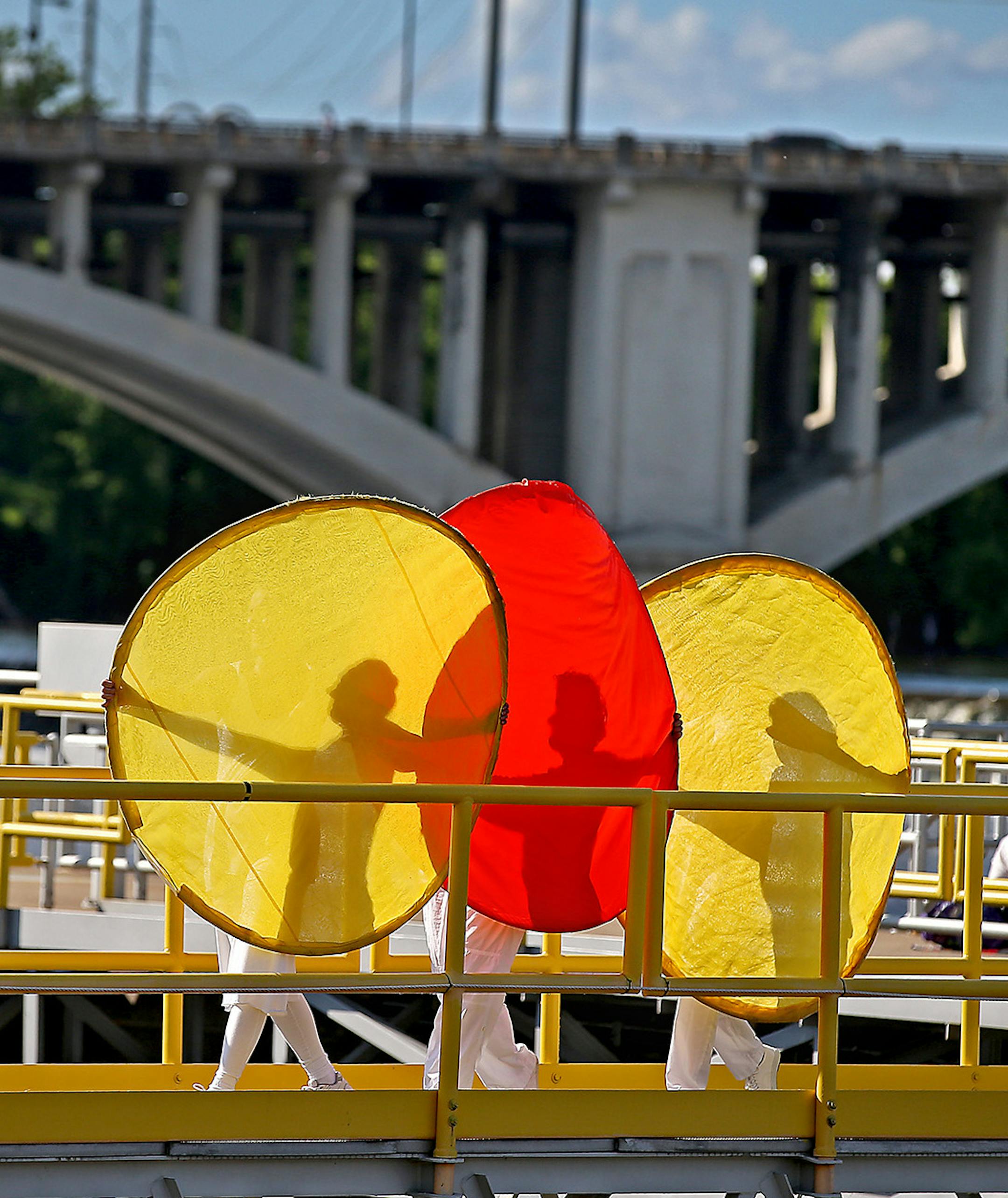 Dancers performed a routine atop the lock and dam during the Solstice River XIX & Global Water Dances, Saturday, June 20, 2015 in Minneapolis, MN. The one-day event, which includes dancers performing in the area including the lock and dam, illuminates water issues through the art of dance around the world. ] (ELIZABETH FLORES/STAR TRIBUNE) ELIZABETH FLORES &#xa5; eflores@startribune.com