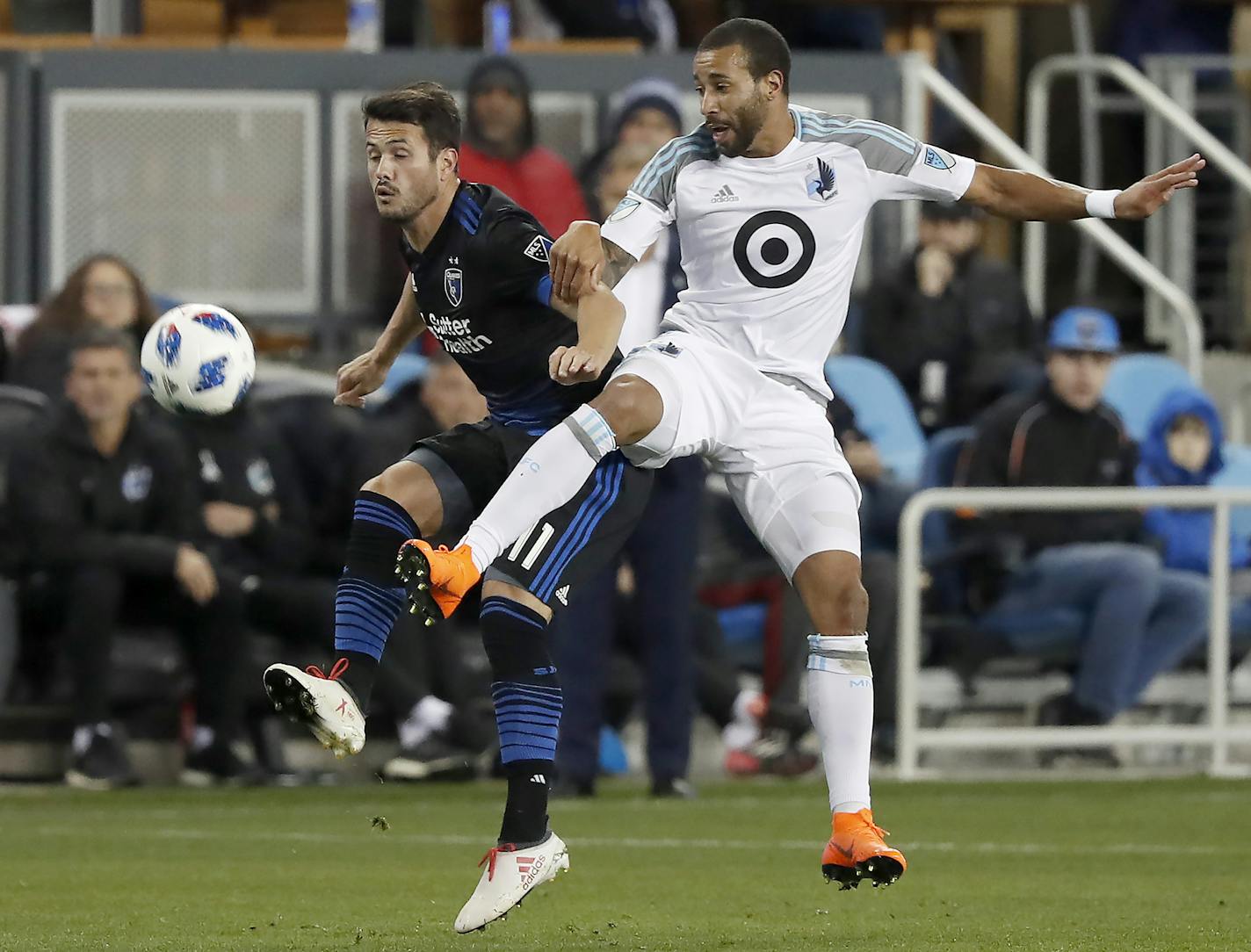 San Jose Earthquakes midfielder Vako (11) battles for the ball against Minnesota United defender Tyrone Mears (4) during the first half of an MLS soccer match in San Jose, Calif., Saturday, Mar 3, 2018. (AP Photo/ Tony Avelar) ORG XMIT: MIN1803032237134090