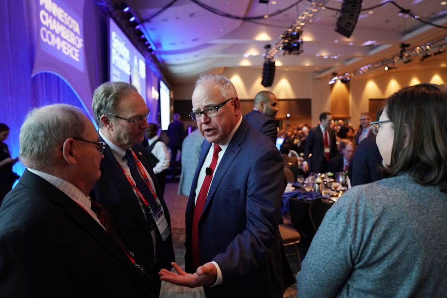 Gov. Tim Walz spoke with Sen. Gary Dahms, left, and Rep. Paul Torkelson during the Minnesota Chamber of Commerce's annual policy kickoff event Wednesday.