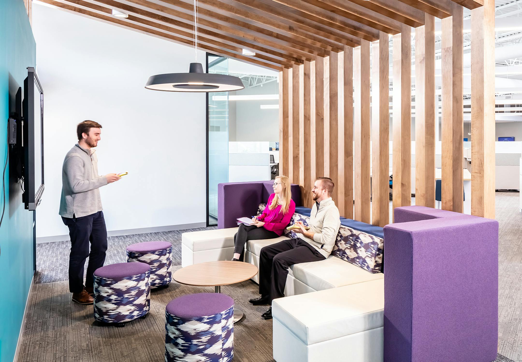 Employees at work at Energy Management Collaborative's refurbished and efficiently lit headquarters; a former warehouse in Plymouth. Photo: Brandon Stengel