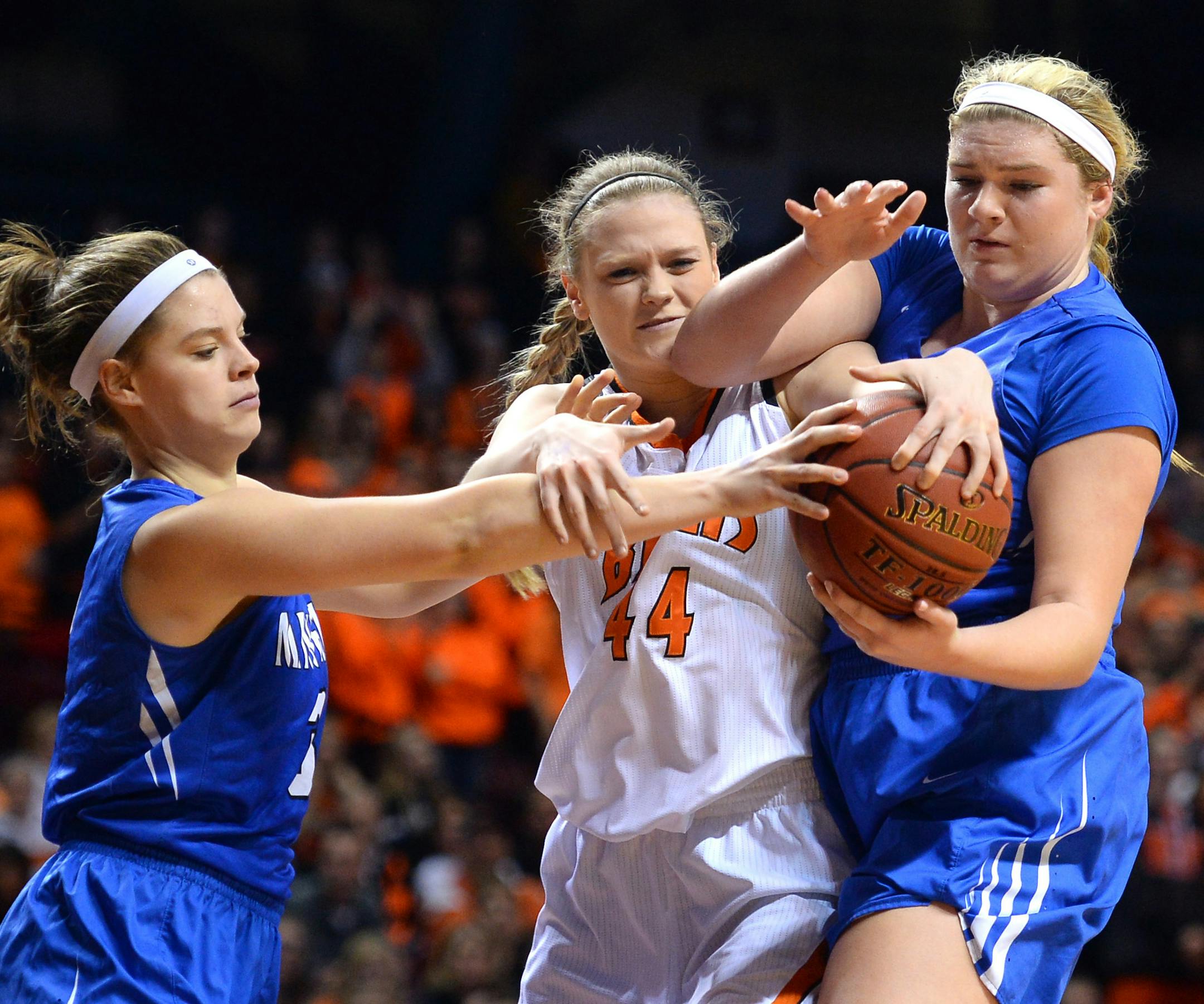 White Bear Lake center Brianna Karg (44) fought for a loose ball with Minnetonka guard Grace Allen (3) and forward Lizzie Odegard (54) in the first half, leading to a White Bear Lake possession after a jump ball call. ] (AARON LAVINSKY/STAR TRIBUNE) aaron.lavinsky@startribune.com White Bear Lake played Minnetonka in the Class 4A girls' basketball semifinals on Thursday, March 17, 2016 at Williams Arena in Minneapolis, Minn.