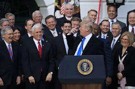 Republican lawmakers including, from left, Senate Majority Leader Mitch McConnell, Vice President Mike Pence and House Speaker Paul Ryan reacted as Pr