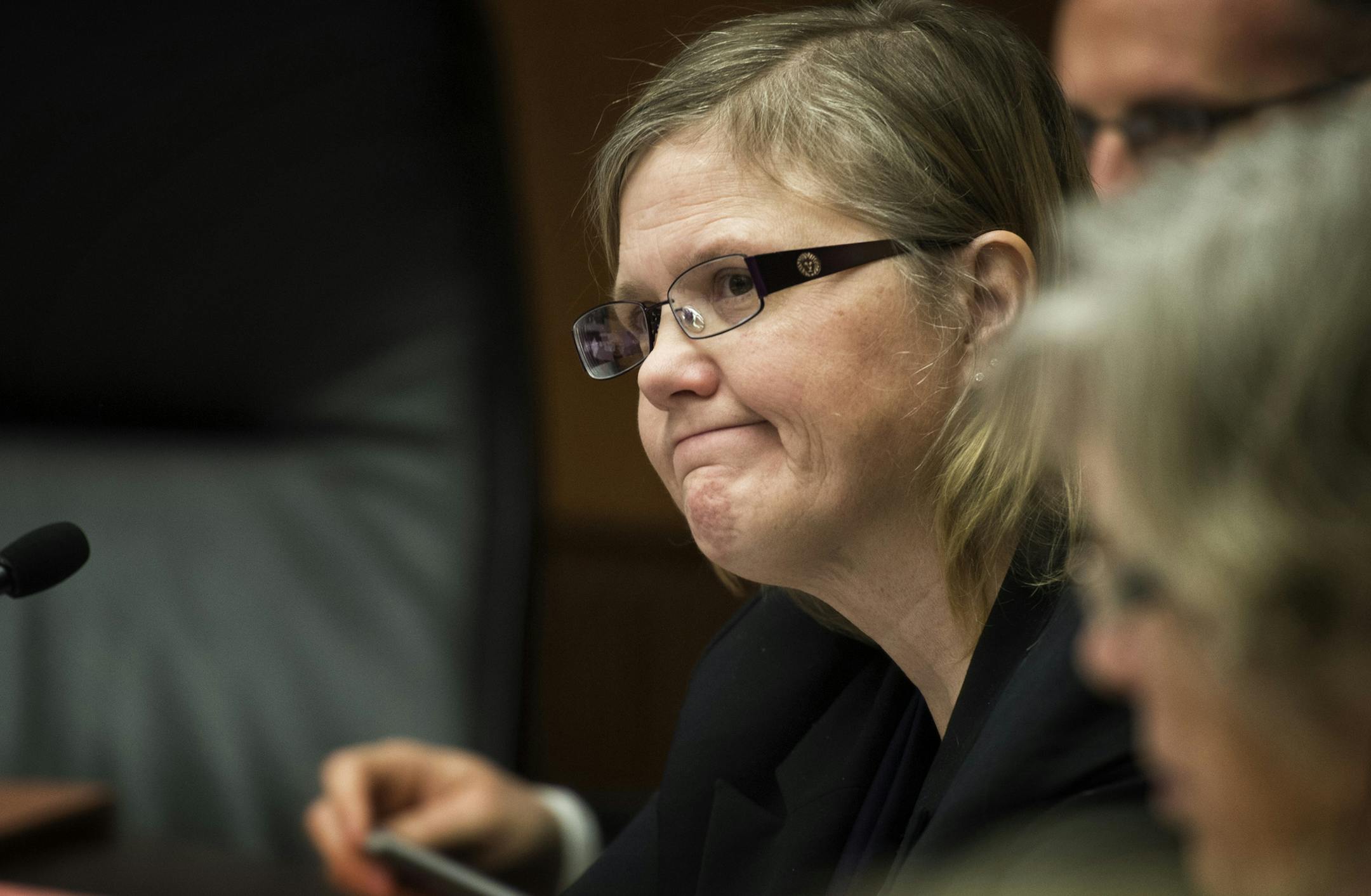 DFL Rep. Debra Hilstrom listened at DFL Rep. Michael Paymar defended his background check bill. Hilstrom is the author of the compromise bill that does not have the background check provision. Supporters of universal background checks for guns faced a stiff test in House public safety committee Tuesday, March 19, 2013. The bill containing background checks may not have the votes, and the sponsor is seeking a last-minute compromise to keep the concept alive. ] GLEN STUBBE * gstubbe@startribune.co