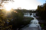 Water flows over the falls at Gooseberry State Park in Silver Creek Township, Minn., in April. The summer travel season has begun, but that shouldn't 