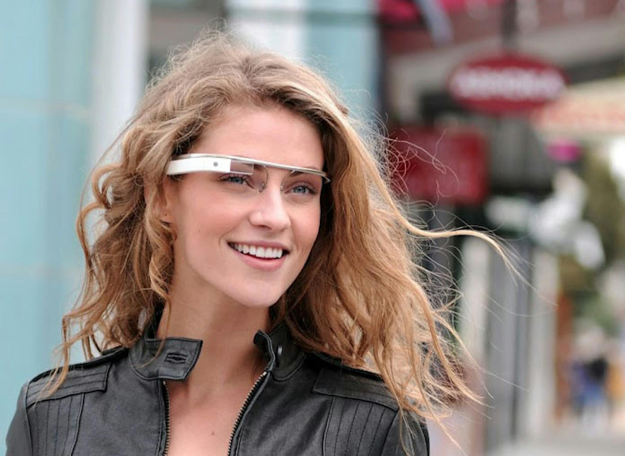 In this undated handout photo provided by the Google[x] group's "Project Glass", an early prototype of Google's futuristic Internet-connected glasses, are modeled. The specs are said to give you directions, let you video chat, shop and do everything else you now need a handheld gadget to accomplish. Google gave a glimpse of "Project Glass" in a video and blog post this week. (AP Photo/Google)