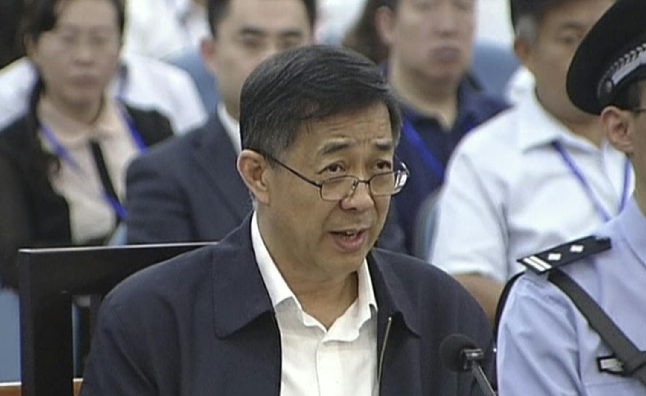 In this image taken from video, Former Chinese politician Bo Xilai speaks in a court room at Jinan Intermediate People's Court in Jinan, eastern China's Shandong province, Sunday, Aug. 25, 2013. Bo on Sunday sought to discredit his former top aide as a lying, unreliable witness as the ousted leader denied criminal responsibility in the country's messiest political scandal in decades.decades. (AP Photo/CCTV via AP Video) CHINA OUT, TV OUT ORG XMIT: MIN2013082614585843