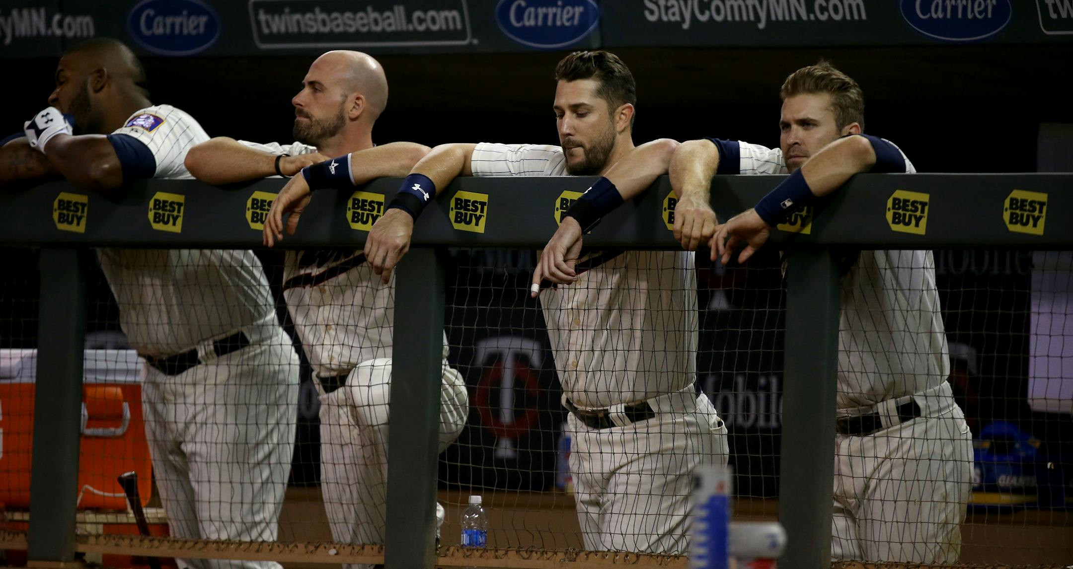 Twins players watched the second game of a doubleheader at Target Field come to a close Saturday night. The Twins were swept by the Los Angeles Angels.