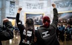 Protesters chant "acquittal is a cover up" in the Capitol rotunda in Washington on Wednesday, Feb. 5, 2020. The Senate is expected to vote Wednesday a