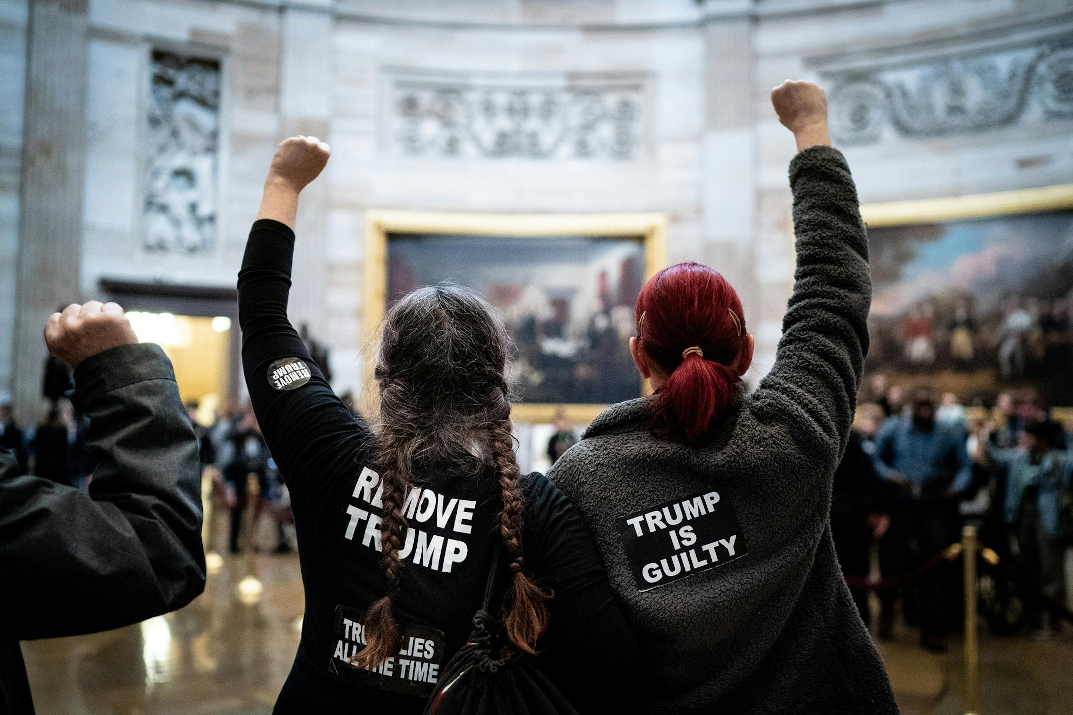 Protesters chant "acquittal is a cover up" in the Capitol rotunda in Washington on Wednesday, Feb. 5, 2020. The Senate is expected to vote Wednesday afternoon to acquit President Dondald Trump in his Senate impeachment trial. (Erin Schaff/The New York Times)