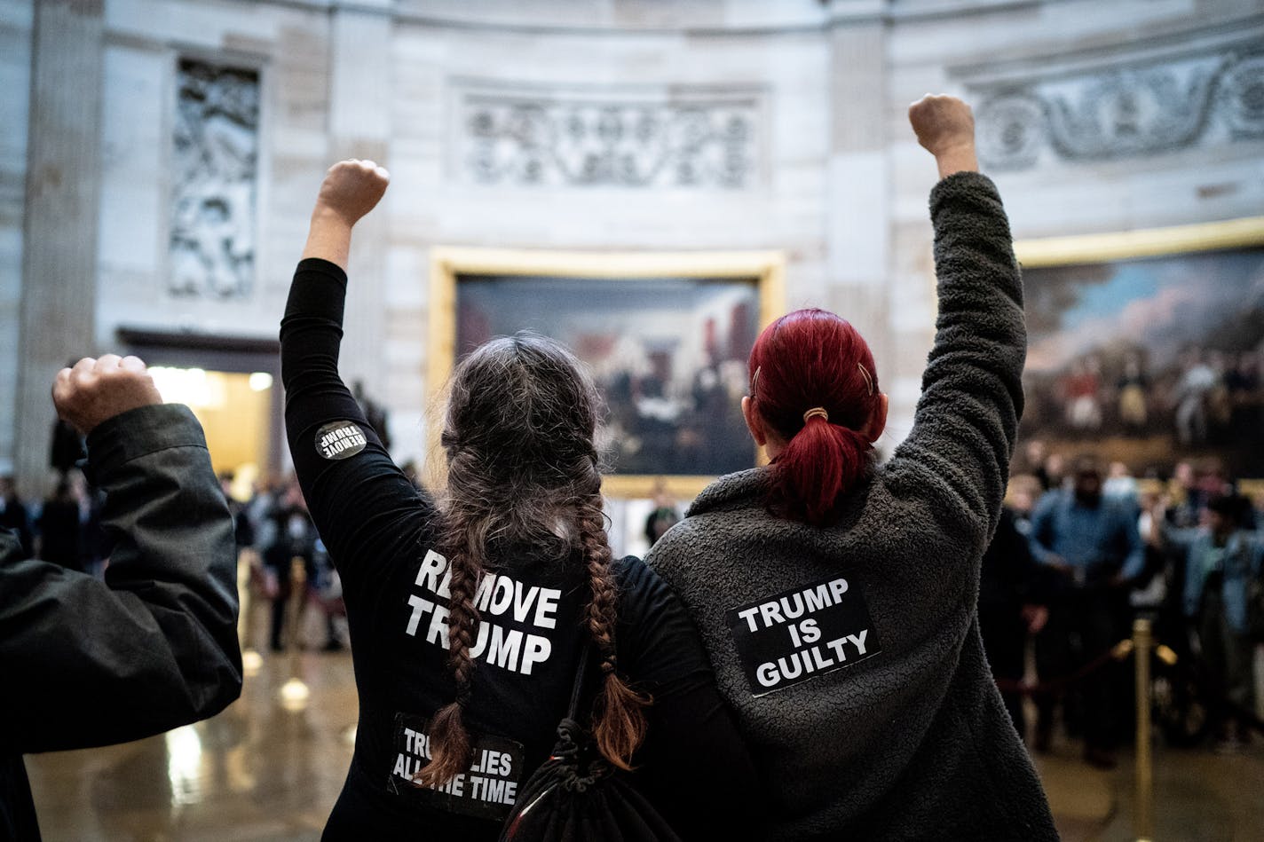 Protesters chant "acquittal is a cover up" in the Capitol rotunda in Washington on Wednesday, Feb. 5, 2020. The Senate is expected to vote Wednesday afternoon to acquit President Dondald Trump in his Senate impeachment trial. (Erin Schaff/The New York Times)