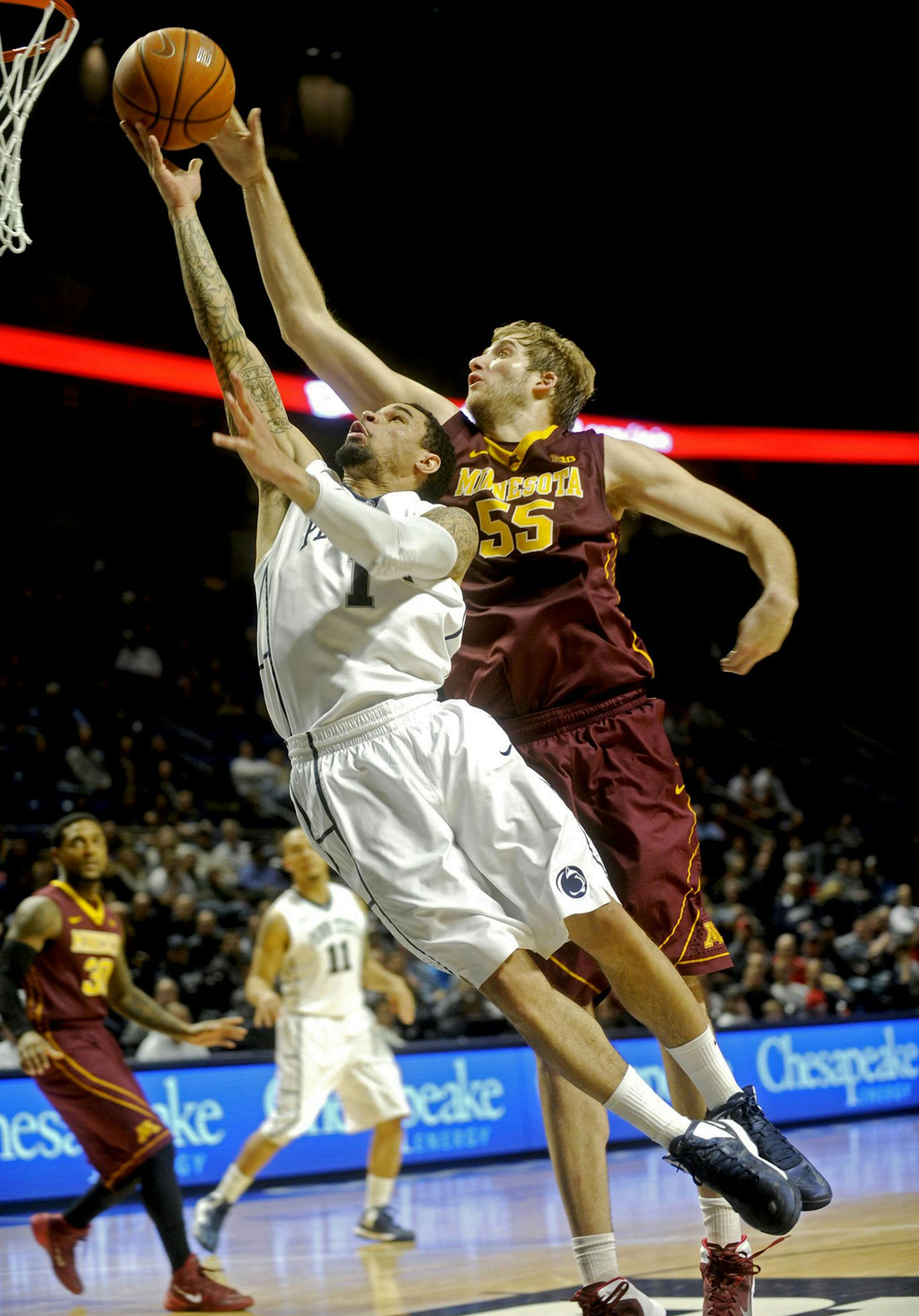 Minnesota Gophers' Elliott Eliason tries to block a shot by Penn State Nittany Lions' John Johnson at the Bryce Jordan Center in State College, Pa., on Wednesday, Jan. 8, 2014. Minnesota won, 68-65. (Abby Drey/Centre Daily Times/MCT) ORG XMIT: 1147665 ORG XMIT: MIN1401082136020110