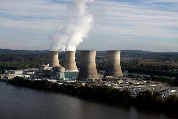 In this Oct. 19, 2005, file photo, steam billows from two active cooling towers of the Three Mile Island nuclear power plant in Middletown, Pa.