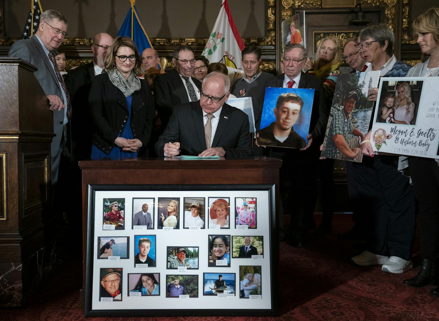 Gov. Tim Walz signed the hands-free cellphone bill into law while surrounded by family members of victims of distracted driving at the Capitol in St. Paul, Minn., on Friday, April 12, 2019. ] RENEE JONES SCHNEIDER &#xa5; renee.jones@startribune.com