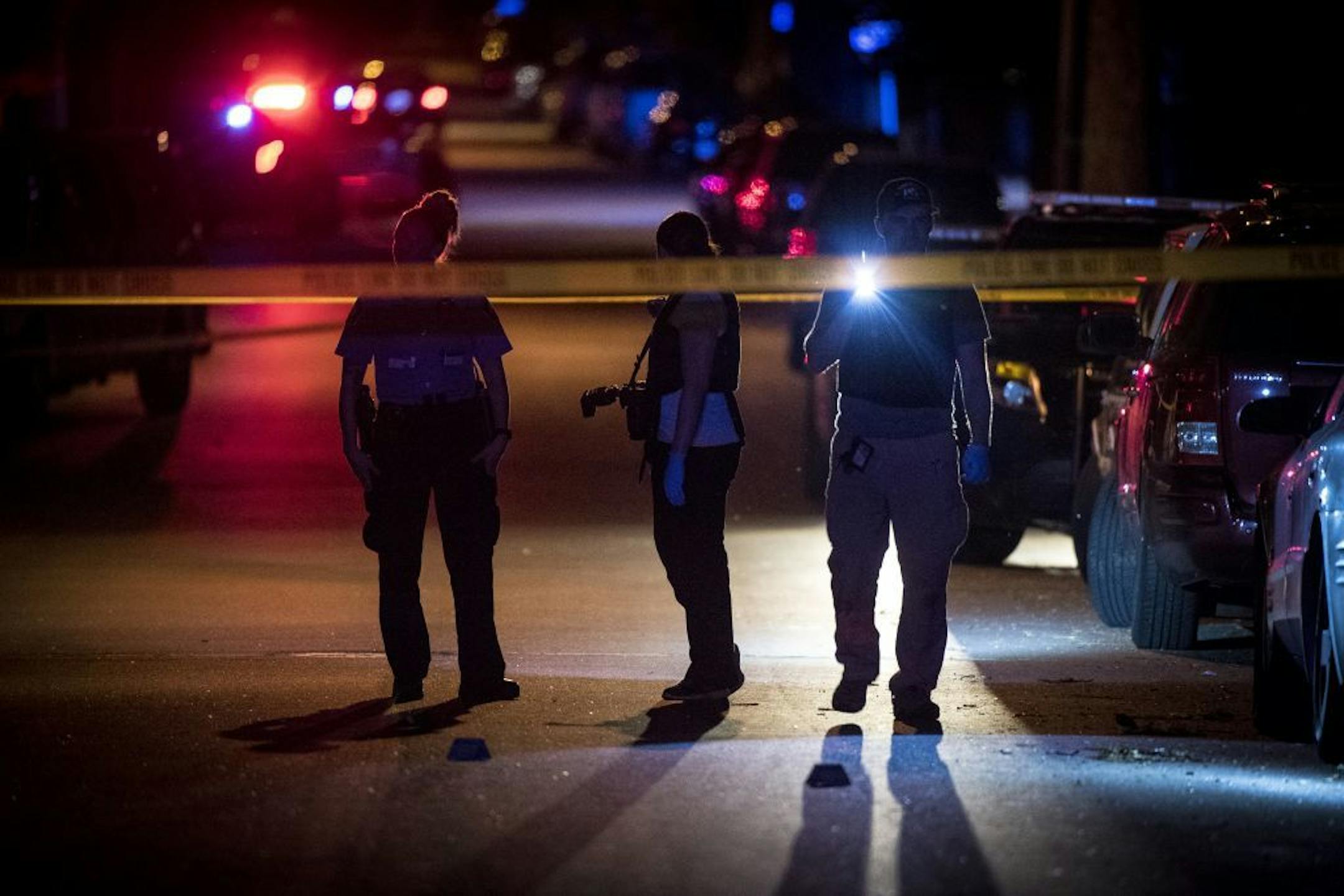 Minneapolis Police Crime Lab investigators arrived on the scene of a shooting on Logan Avenue between north 35th and 36th avenues late Thursday night.