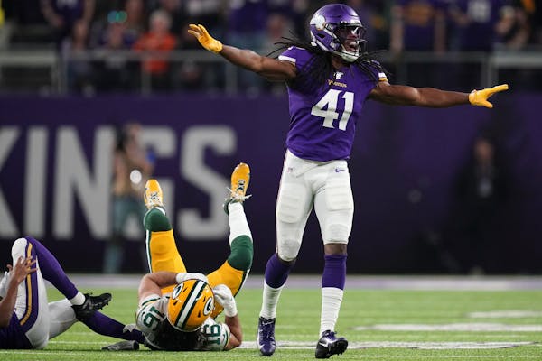 Green Bay Packers wide receiver Jake Kumerow (16) was brought down by Minnesota Vikings defensive back Anthony Harris (41) and Minnesota Vikings corne
