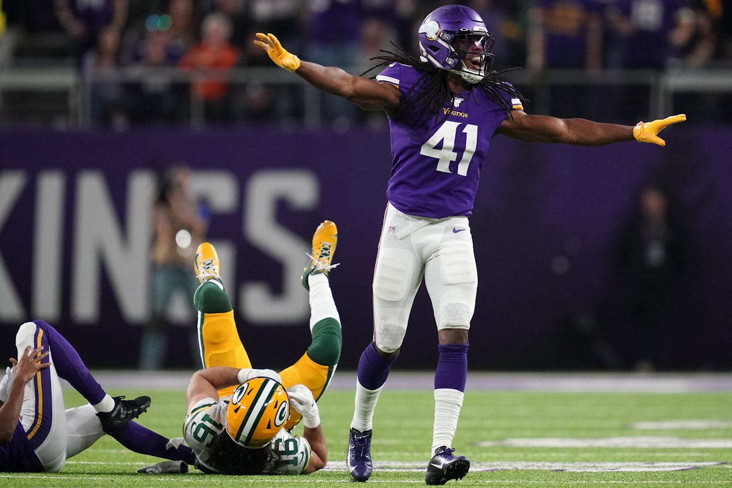 Green Bay Packers wide receiver Jake Kumerow (16) was brought down by Minnesota Vikings defensive back Anthony Harris (41) and Minnesota Vikings cornerback Trae Waynes (26) in the third quarter. ] ANTHONY SOUFFLE • anthony.souffle@startribune.com The Minnesota Vikings played the Green Bay Packers in an NFL game Monday, Dec. 23, 2019 at U.S. Bank Stadium in Minneapolis. ORG XMIT: MIN1912232239461112