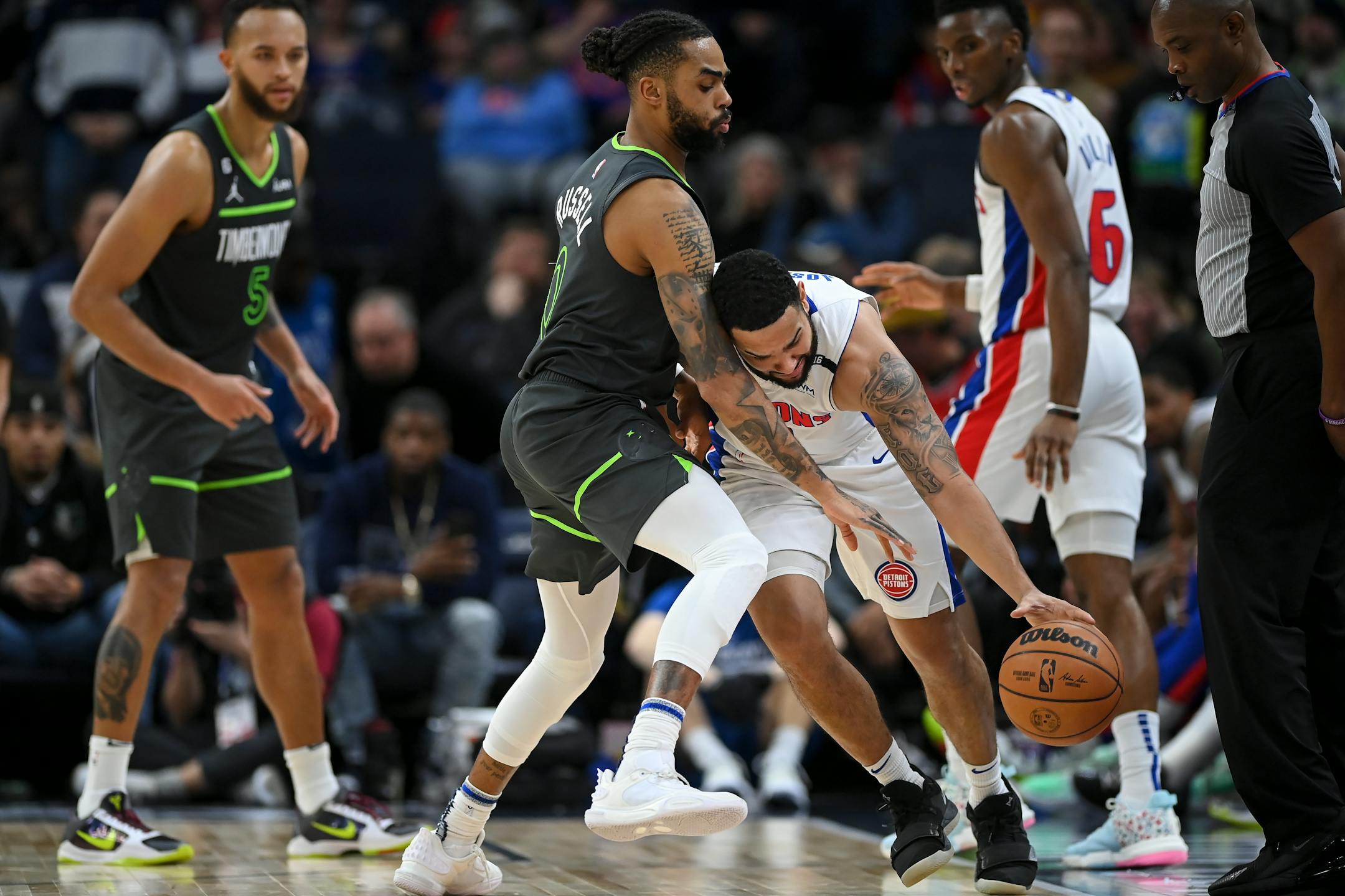Minnesota Timberwolves guard D'Angelo Russell (0) is called for a reaching foul against Detroit Pistons guard Cory Joseph (18) during the fourth quarter.
