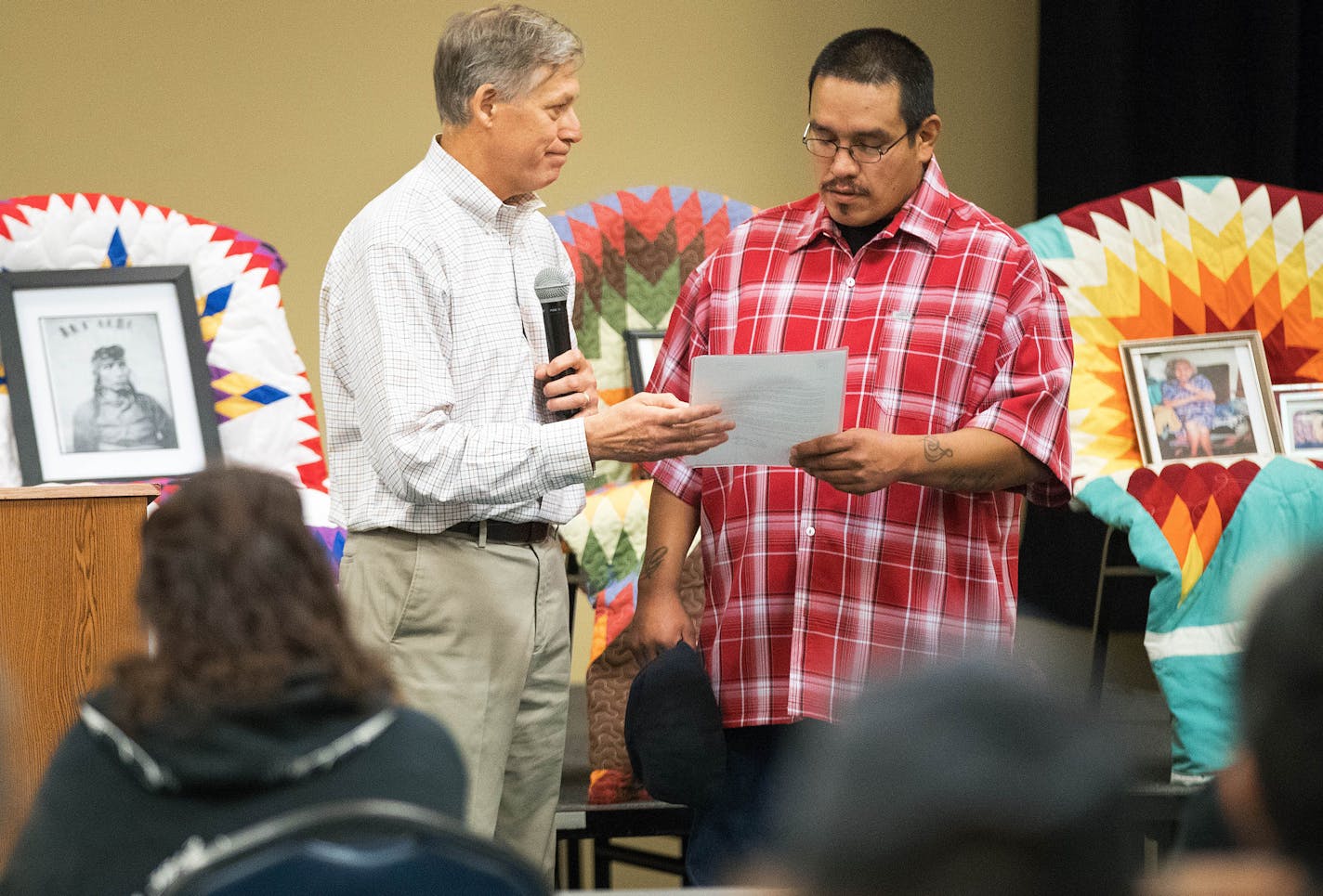 Gary Red Owl, right, a decedent of Santee Chief Cut Nose, receives an apology letter from Jeff Bolton, the Vice President and Chief Administrative Officer of the Mayo Clinic, at the Ohiya Casino and Resort on Friday, Aug. 31, 2018, in Niobrara , Nebraska. The leadership of the Mayo Clinic apologized for their part in one of the darkest chapters in American history: The largest mass execution in U.S. history, the 1862 hanging of 38 Santee warriors. The execution warrant was signed by Abraham Linc