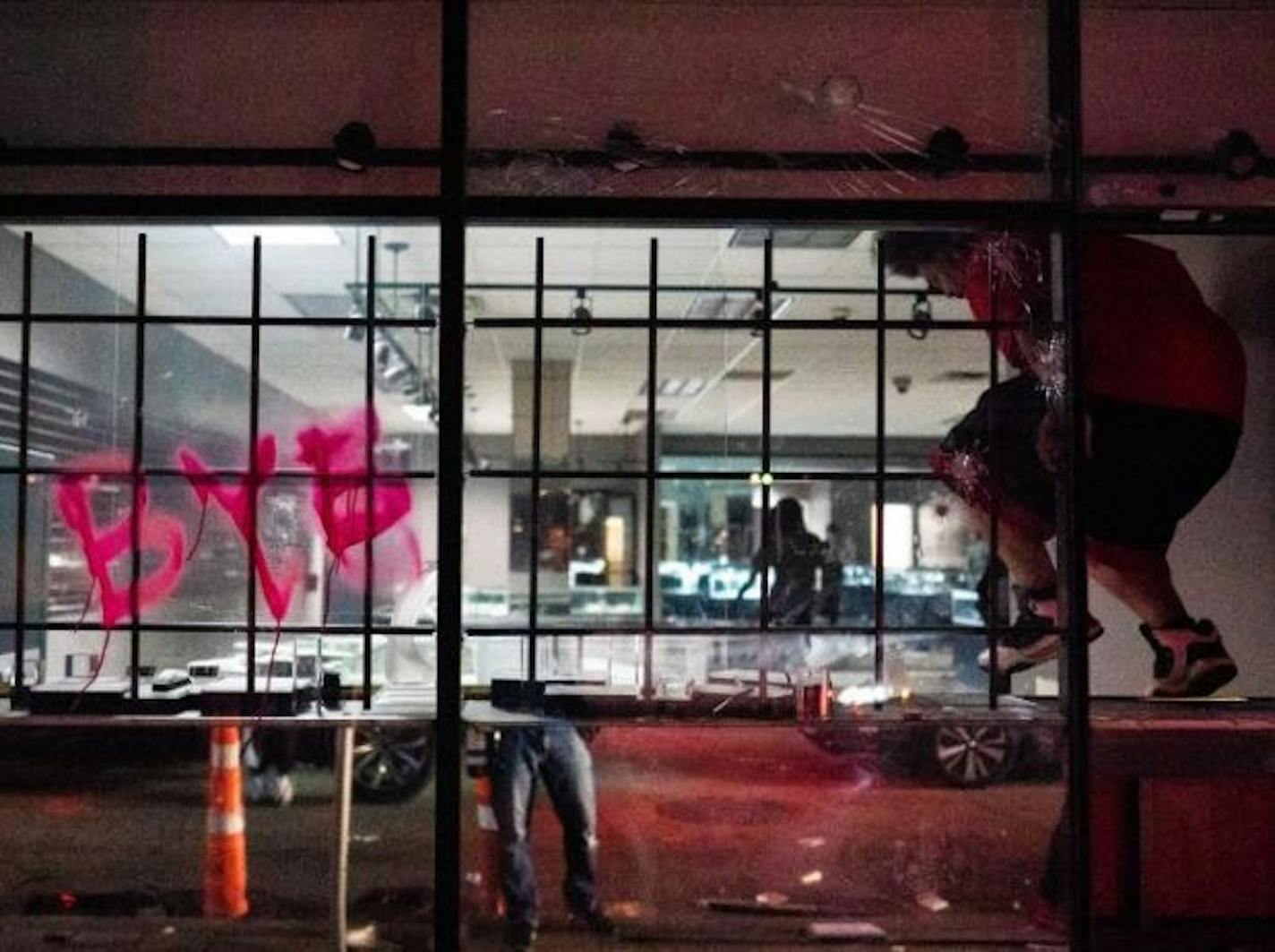 Looters trash Cadillac Pawn where a shop owner allegedly shot and killed a looter earlier Wednesday evening. (Mark VanCleave)