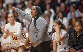 Minneapolis Roosevelt coach Tyesha Wright points the way Wednesday during her team's Class 3A quarterfinal.