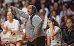 Minneapolis Roosevelt coach Tyesha Wright points the way Wednesday during her team's Class 3A quarterfinal.
