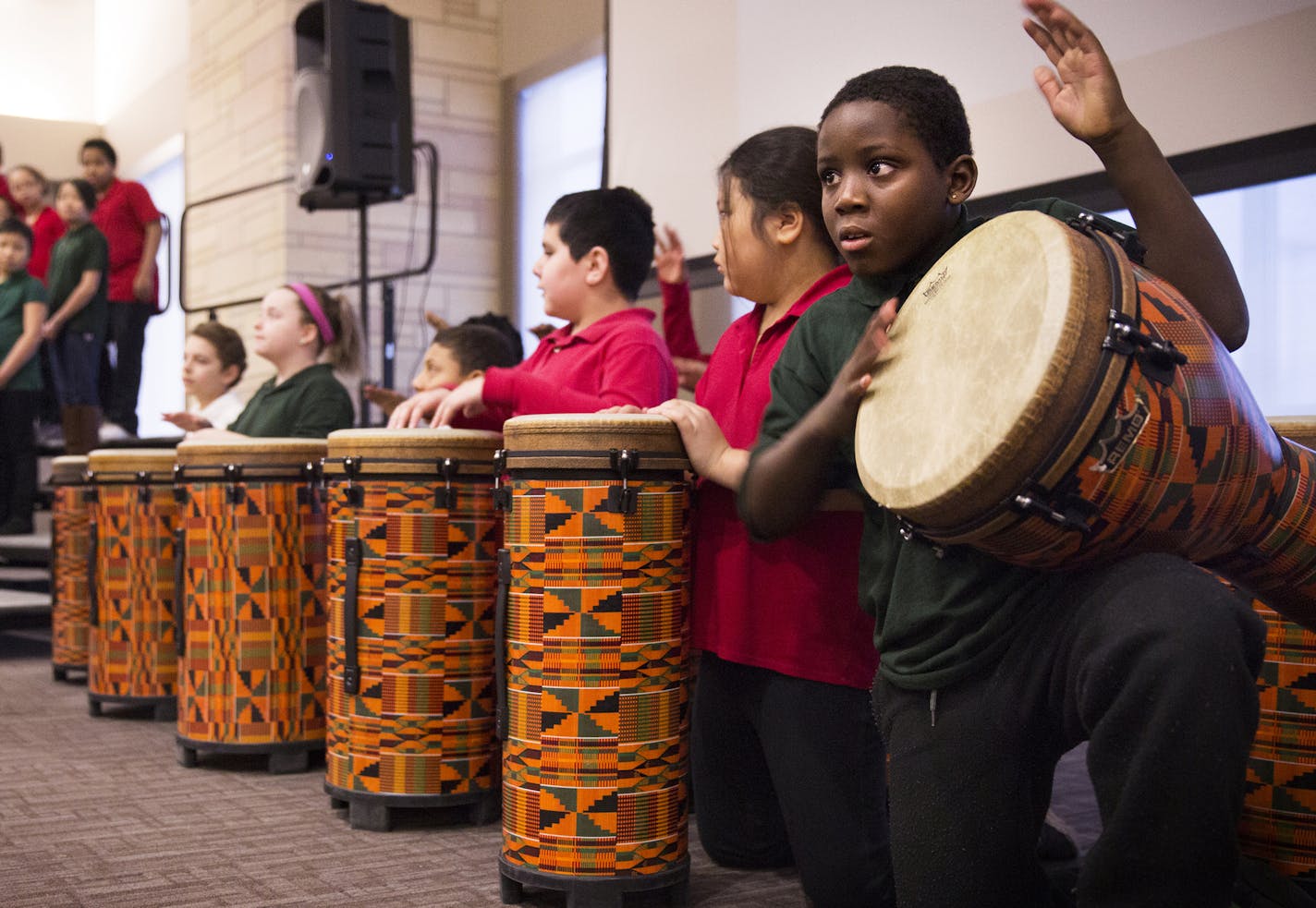 Fourth grader Da'vion George, 9, of Four Seasons A+ Elementary School in St. Paul performs a drum solo during a performance of the Nigerian folk song "Eseoluwa" in the Yoruba language before the St. Paul Public Schools State of the District address at University of St. Thomas in St. Paul on Thursday, January 29, 2015. ] LEILA NAVIDI leila.navidi@startribune.com /