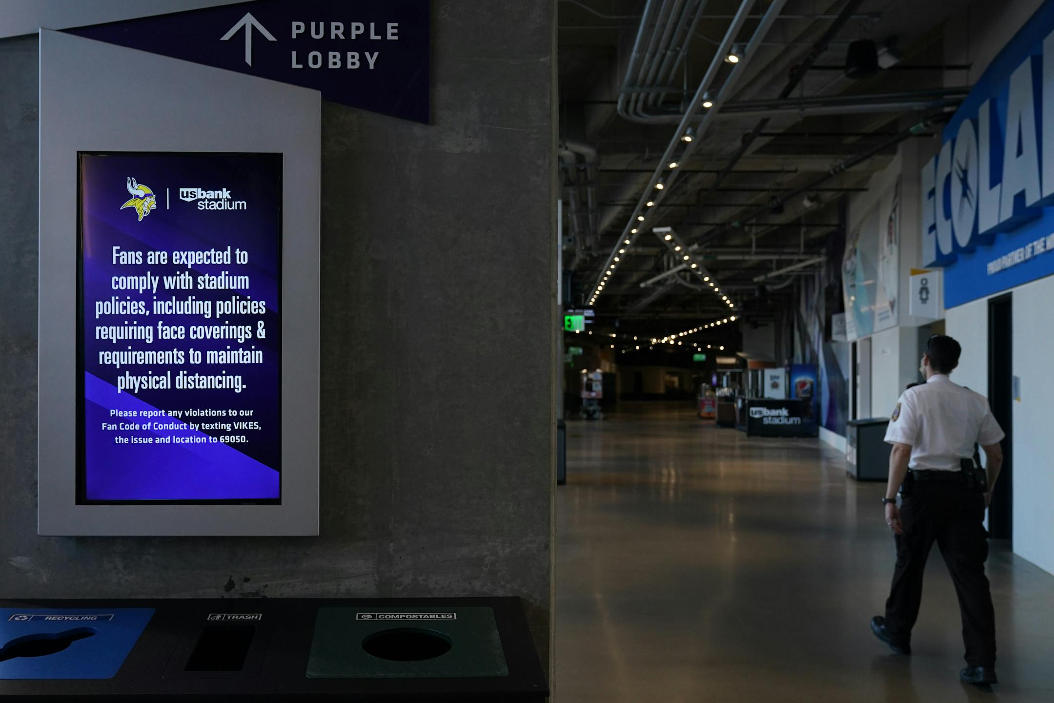 A health warning flashed on screens in the empty U.S. Bank Stadium concourse as the Minnesota Vikings and Chicago Bears warmed up without fans in attendance per state regulations meant to slow the spread of COVID-19.