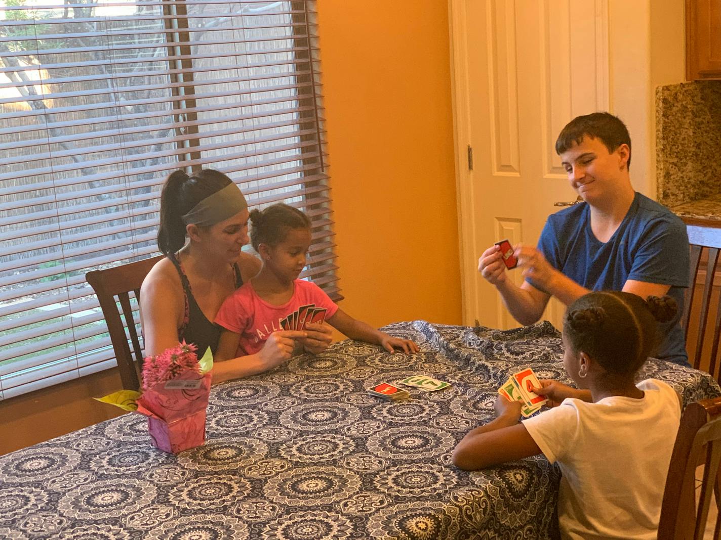 Much of Danielle Andersen's card playing these days is with son Easton & neighbor girls Emerson (on lap) & Kendall.