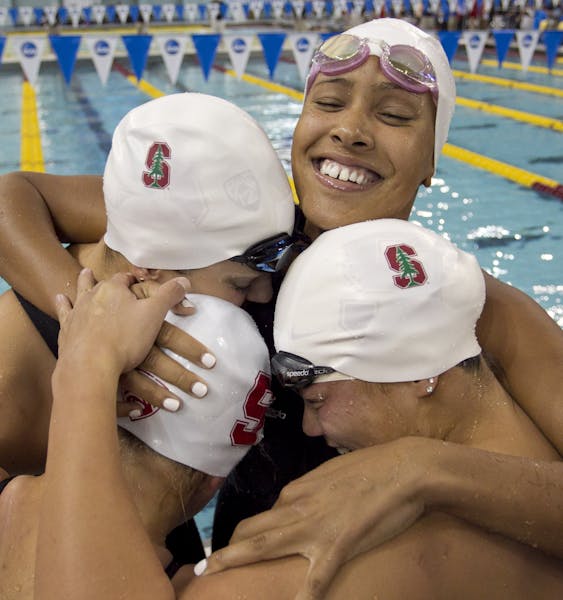 Members of the Stanford 200-yard medley relay team, Maddy Schaefter, Nicole Stafford, Sarah Haase and Felicia Lee, celebrate after winning the race at