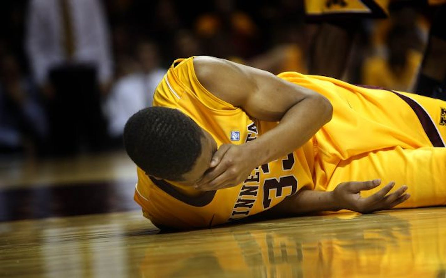 Minnesota's Rodney Williams reacted after being elbowed in the face in the second half.