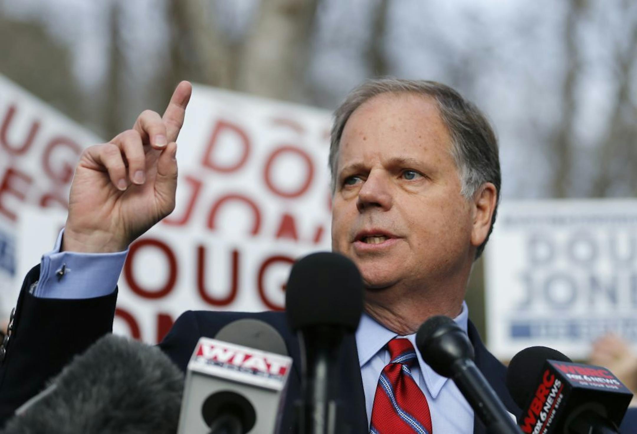 Democratic candidate for U.S. Senate Doug Jones speaks to reporters after casting his ballot Tuesday, Dec. 12, 2017, in Mountain Brook , Ala. Jones is facing Republican Roy Moore.
