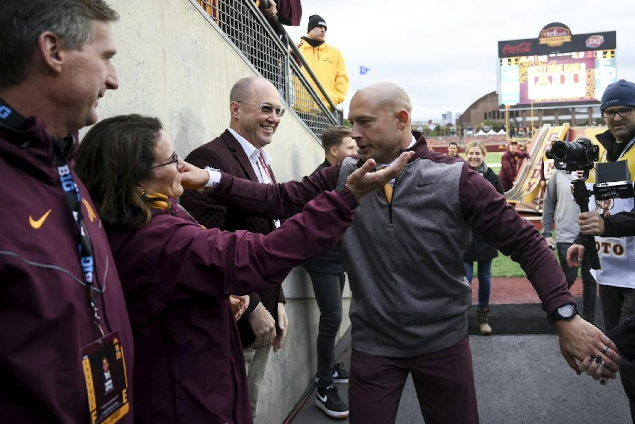 Gophers coach P.J. Fleck hugged University of Minnesota president Joan Gabel following a 40-17 defeat of Illinois on Oct. 5.