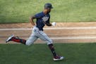 Byron Buxton runs to first in an intrasquad scrimmage at target Field,