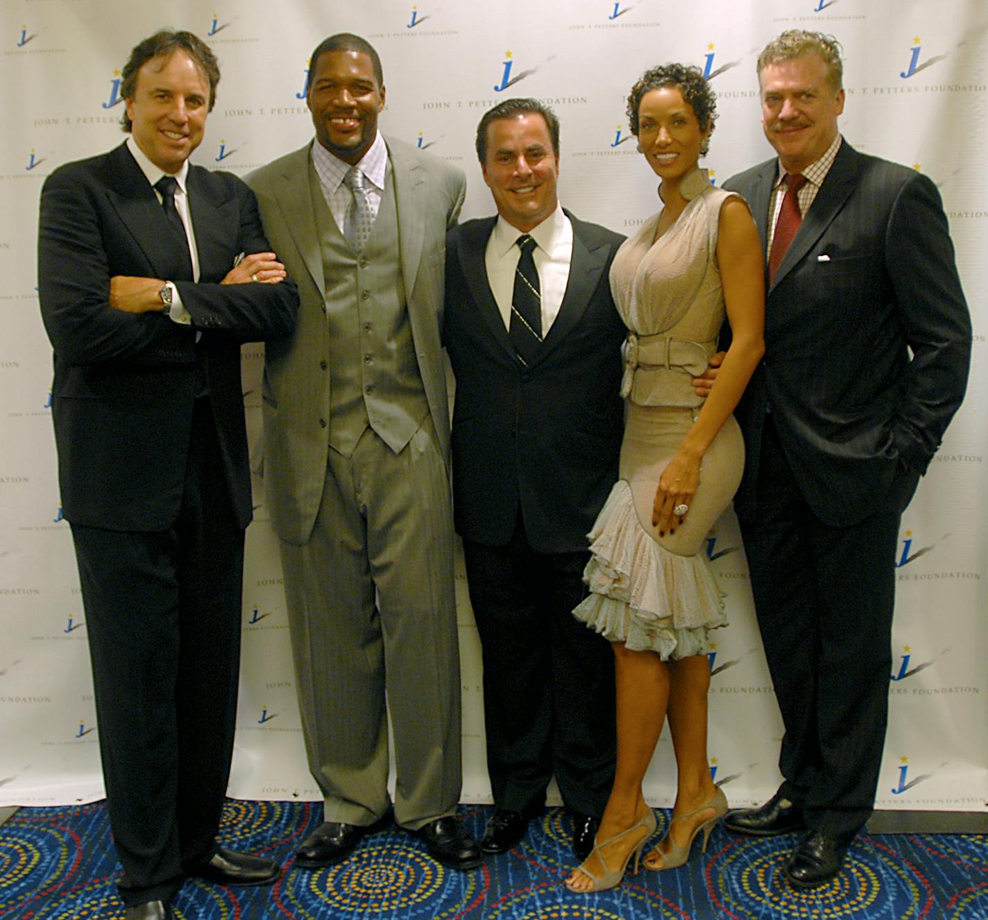 Tom Petters, center, is flanked by actor Kevin Nealon, far left; NFL Football Player Michael Strahan, middle left; Nicole Murphy, middle right; and Actor Chris McDonald during the John T. Petters Foundation gala on August 9th, 2008 in Minneapolis.