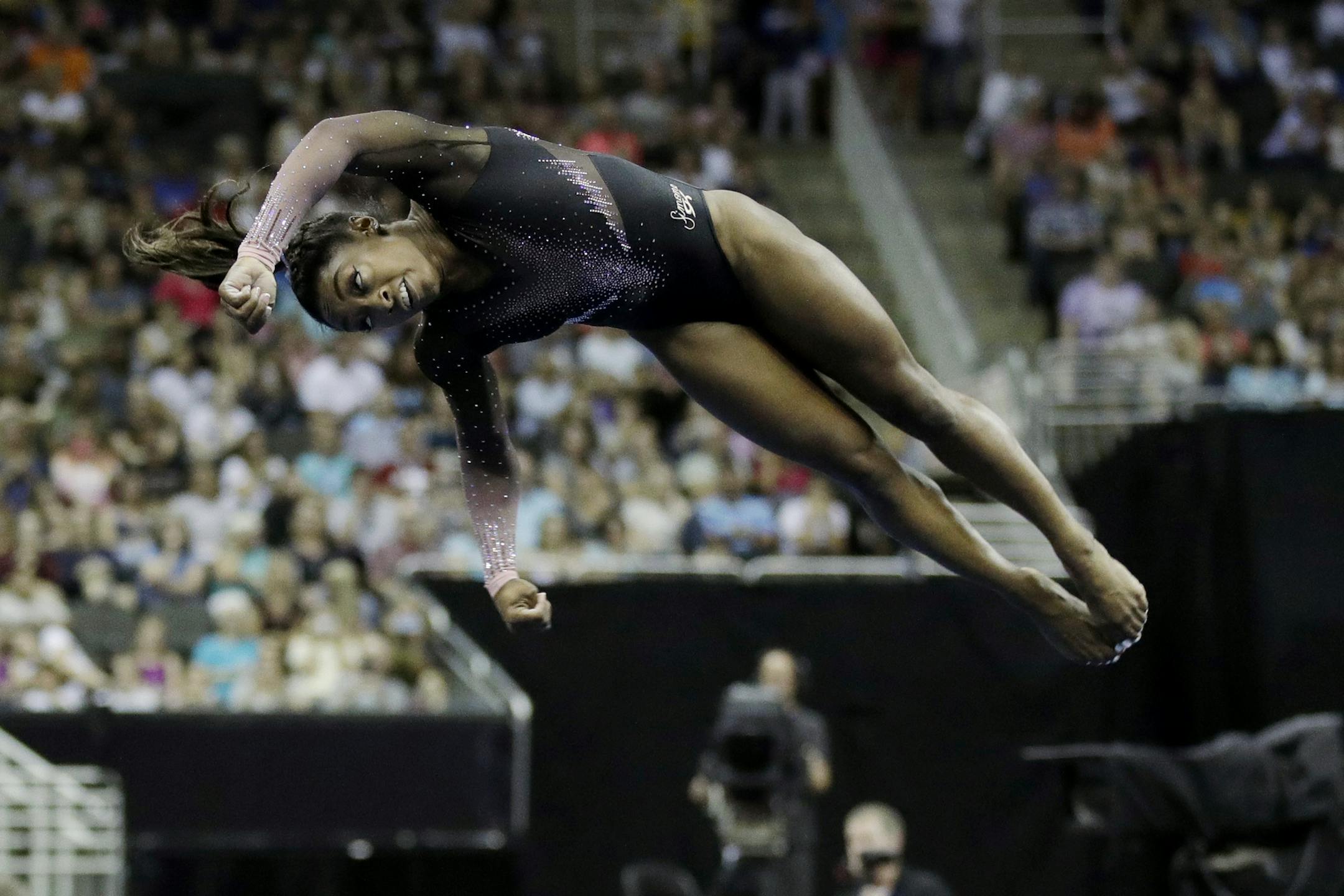 Simone Biles competes in the floor exercise during the senior women's competition at the 2019 U.S. Gymnastics Championships Sunday, Aug. 11, 2019, in Kansas City, Mo. (AP Photo/Charlie Riedel)