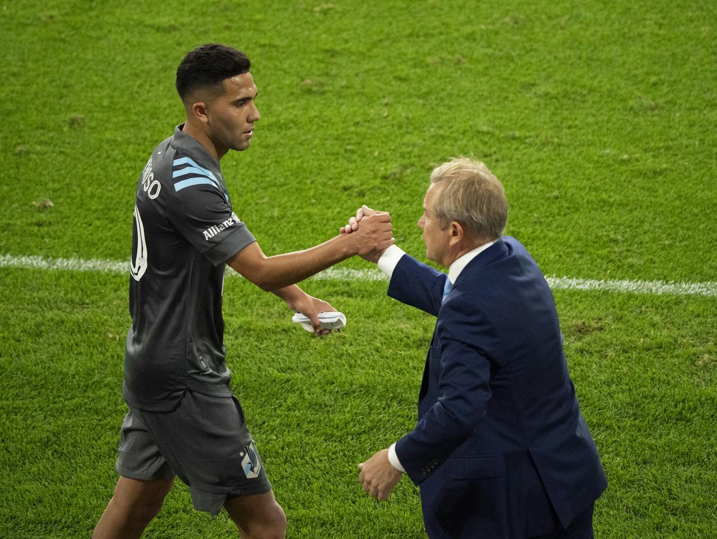 Minnesota United midfielder Emanuel Reynoso (10) was greeted by head coach Adrian Heath as he came off the pitch in the second half. ] JEFF WHEELER • jeff.wheeler@startribune.com The MN United Football Club faced Real Salt Lake in an MLS soccer match Sunday night, September 6, 2020 at Allianz Field in St. Paul.