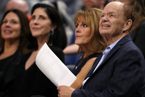 Minnesota Timberwolves team owner Glen Taylor watched from the sidelines with his wife Becky Mulvihill in the second half.