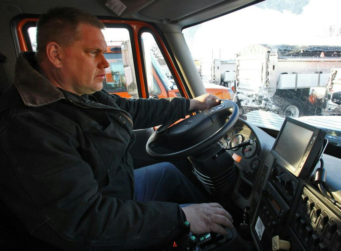 MNDOT is equiping plows with sensors that can read road conditions to combine with weather forecasts to determine where and how to plow fallen snow on area roads. Mechanic Terry Anderson sat in a cab of a plow outfitted with a weather sensor that would give a readout on the computer screen, right