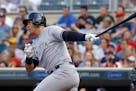 Yankees designated hitter Alex Rodriguez follows through on a single to center off Twins starter Phil Hughes during the first inning Friday.