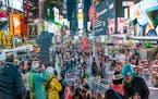 New York, NY, USA - December 7, 2016: A panoramic view of Times Square and all the people in Times Square, New York City.