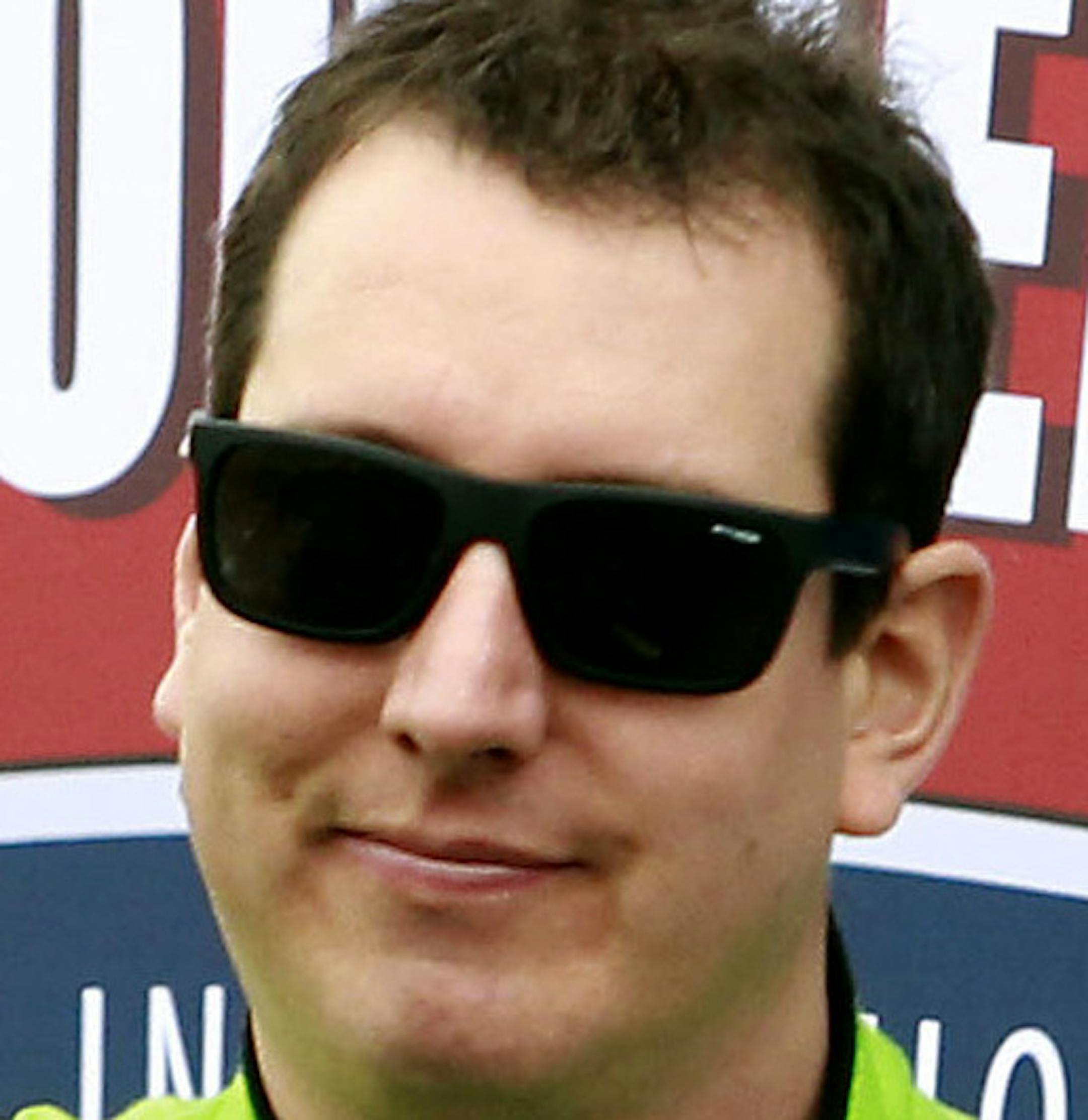 Kyle Busch waves to the crowd during driver introductions before the NASCAR Sprint Cup Series auto race at Phoenix International Raceway, Sunday, Nov. 15, 2015, in Avondale, Ariz. Busch is one of seven drivers looking to clinch a spot in the final Chase for the Cup Championship race in Homestead, Fla. (AP Photo/Ralph Freso)